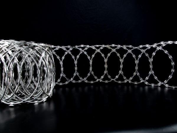 A roll of stretching flat wrap razor wire