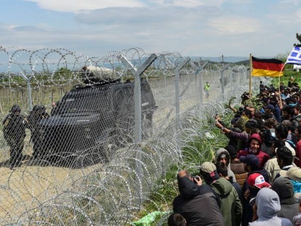 Chain link fence and mobile razor wire security barrier are used for border isolation.