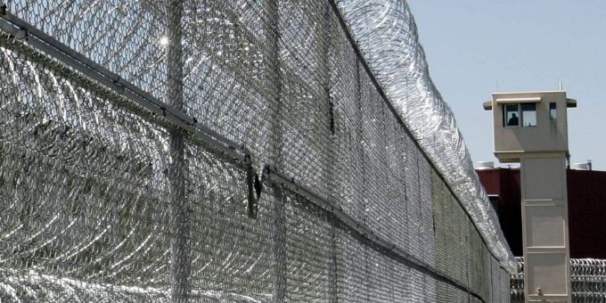 Razor wires are installed on the top of the prison fence.